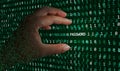 A hacker hand able to find a password hidden in the binary code, and stream of data, and is about to take it to control your
