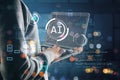Hacker hands using laptop with glowing blurry ai hologram with binary coding on blurry background. Artificial intelligence, Royalty Free Stock Photo