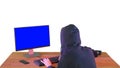 Hacker in hood cracking code using pc on white background. Royalty Free Stock Photo