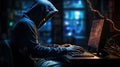 Hacker in hood without a face at laptop. Hacks dark background. Internet scammer or thief. Darknet. Cyber attack