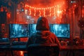 A hacker in the hood is sitting at his desk and looks into three monitors, on which he sees system information. He uses