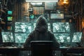 A hacker in the hood is sitting at his desk and looks into three monitors, on which he sees system information. He uses Royalty Free Stock Photo