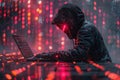 Hacker in a hood using a laptop, coding and data on a code background. Digital symbols and abstract technology concept Royalty Free Stock Photo