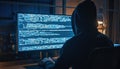 Hacker in hooded shirt working late at night on computer screen filled with glowing blue code dark room Royalty Free Stock Photo