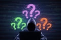 Hacker in hoodie with glowing question marks on digital background. FAQ and solution concept