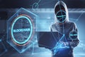 Hacker in hoodie using laptop with creative polygonal blockchain hologram on blurry interior backdrop. Technology, hacking, data