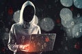 Hacker in hoodie using laptop while standing on abstract hacking background with bokeh circles and binary coding. Malware and Royalty Free Stock Photo