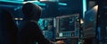 The hacker immersed in coding at a modern, high-tech workspace at night. AI generated image Royalty Free Stock Photo