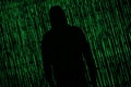 Hacker Internet security concept. Hacker silhouette on matrix background Royalty Free Stock Photo