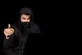 Hacker with laptop and bitcoin initiating cyber attack,  on black Royalty Free Stock Photo