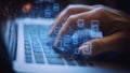 Hacker Man Typing on a Laptop Notebook Keyboard Hacking an Internet Website Network (Computer Coding)