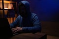 Hacker man working laptop computer. Hacker attack in dark room Royalty Free Stock Photo