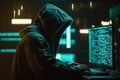 Hacker in a mask and hood looks at the laptop screen. Hacking and malware concept.