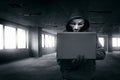 Hacker with mask using laptop