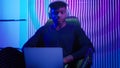 Hacker programmer computer worker gamer African American man in headphones male guy typing laptop online data internet