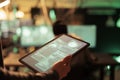 Hacker reading database illegal access message on tablet