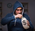 Hacker with sack of money Royalty Free Stock Photo