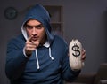 Hacker with sack of money Royalty Free Stock Photo