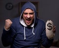 Hacker with sack of money Royalty Free Stock Photo