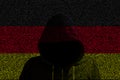 Hacker shininhg through north german computer code flag