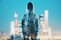 Hacker silhouette on city background
