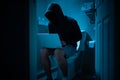 Hacker sit on the toilet Royalty Free Stock Photo