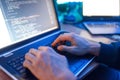 Hacker sitting at laptop, information hacking Royalty Free Stock Photo