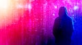 Hacker standing in front of binary code matrix effect, cybersecurity concept Royalty Free Stock Photo
