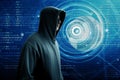 Hacker standing over a screen