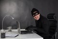 Hacker stealing data and laughing