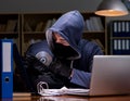 Hacker stealing personal data from home computer Royalty Free Stock Photo