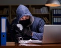 Hacker stealing personal data from home computer Royalty Free Stock Photo