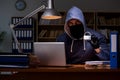 The hacker stealing personal data from home computer Royalty Free Stock Photo