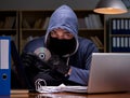 Hacker stealing personal data from home computer Royalty Free Stock Photo