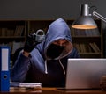 Hacker stealing personal data from home computer Royalty Free Stock Photo