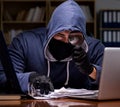 Hacker stealing personal data from home computer Royalty Free Stock Photo