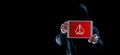 Hacker tablet cyber security. Digital mobile phone in hacker man hand isolated on black banner. Internet web hack