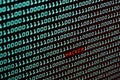 Hacker text and binary code concept from the desktop screen, selective focus