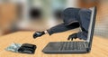 Hacker - thief steals money from laptop Royalty Free Stock Photo