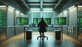 Hacker with Three Screens Displaying Green Code in Cybersecurity Room