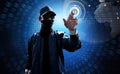 Hacker touching computer screen to unlock secret data Royalty Free Stock Photo