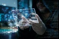 Hacker using clear tablet with HUD panel and code graph bar data Royalty Free Stock Photo