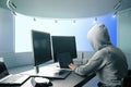 Hacker using computers side Royalty Free Stock Photo