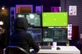 Hacker using green screen PC, coding malware designed to exploit backdoors Royalty Free Stock Photo