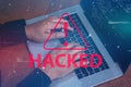 Hacker using a laptop with binary code digital interface. Royalty Free Stock Photo