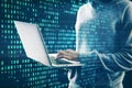 Hacker using laptop with creative digital binary code dots hologram. Digital data hacking concept. Royalty Free Stock Photo