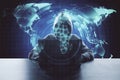 Hacker using laptop with digital blue world map hologram Royalty Free Stock Photo