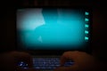 Hacker using laptop. Lots of digits on the computer screen Royalty Free Stock Photo