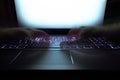 Hacker using laptop. Lots of digits on the computer screen Royalty Free Stock Photo