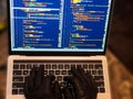 Hacker using malicious code or virus program for anonymous cyber attack. Cybercrime, hacking and technology concept Royalty Free Stock Photo